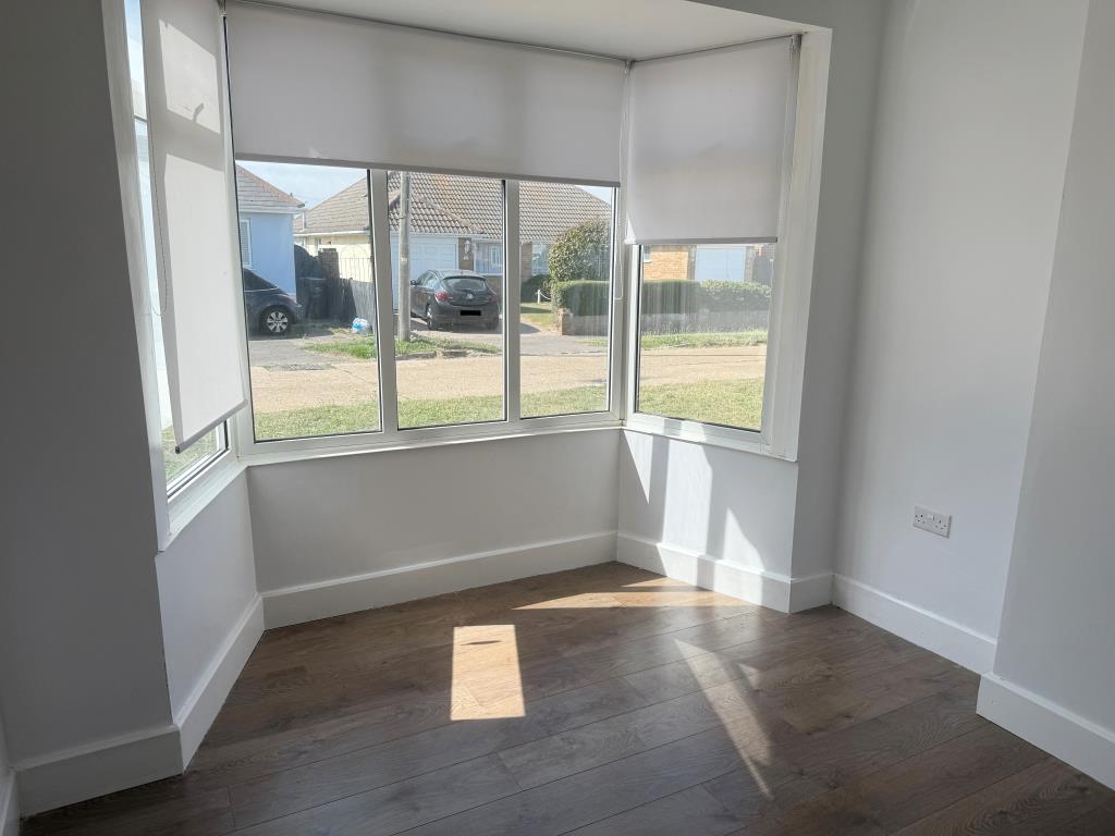 Lot: 150 - DETACHED BUNGALOW FOR INVESTMENT - Main bedroom with window overlooking Slindon Avenue